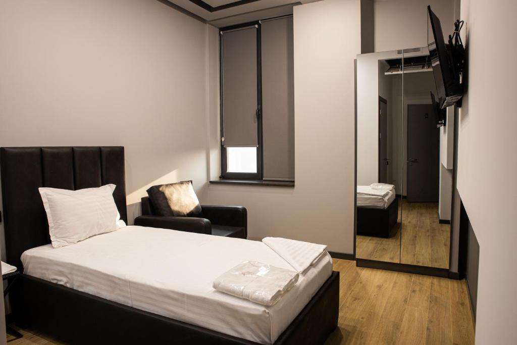 Postel nebo postele na pokoji v ubytování Hotel Elion