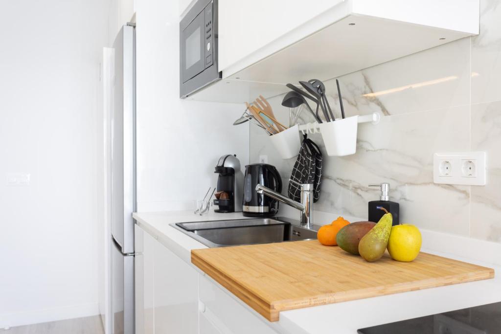 A kitchen or kitchenette at Home2Book Olympo Suite
