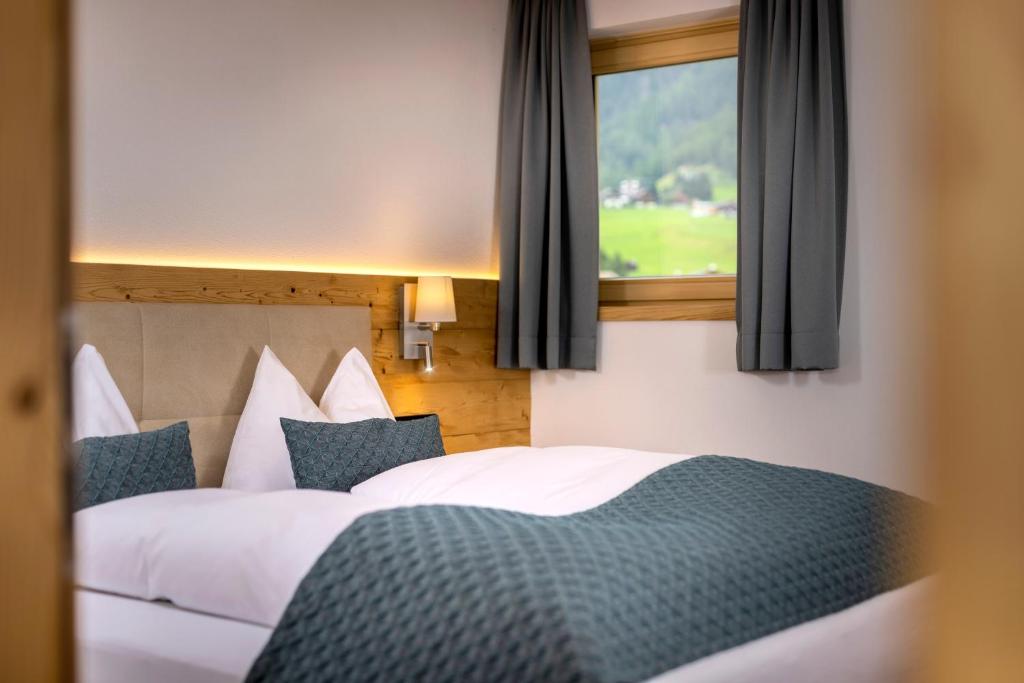 Una cama o camas en una habitación de Gamsalm