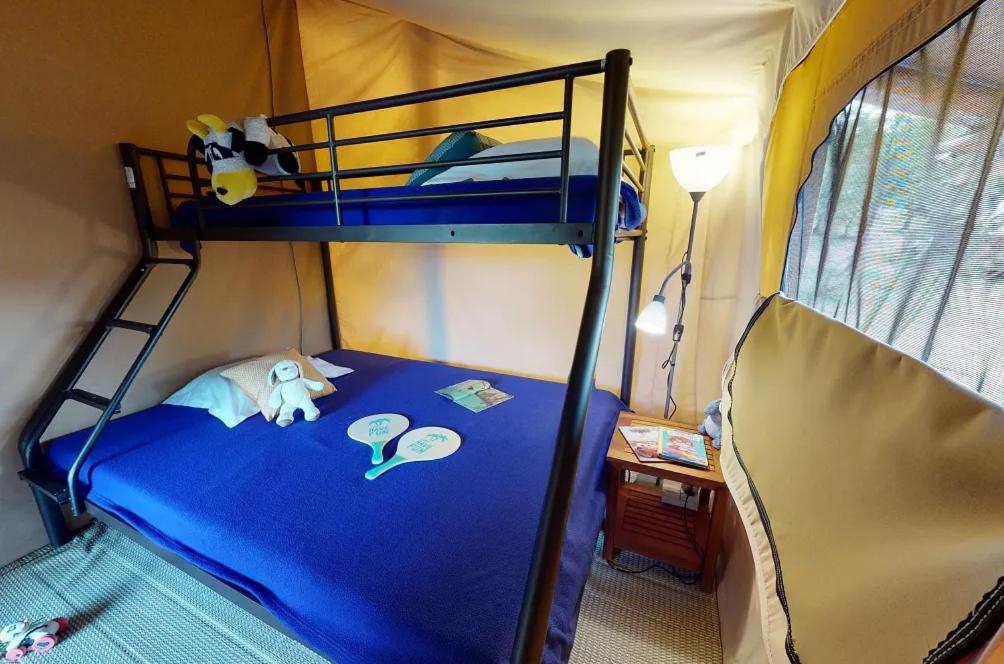 Posteľ alebo postele v izbe v ubytovaní Campasun Camping de l'Aigle
