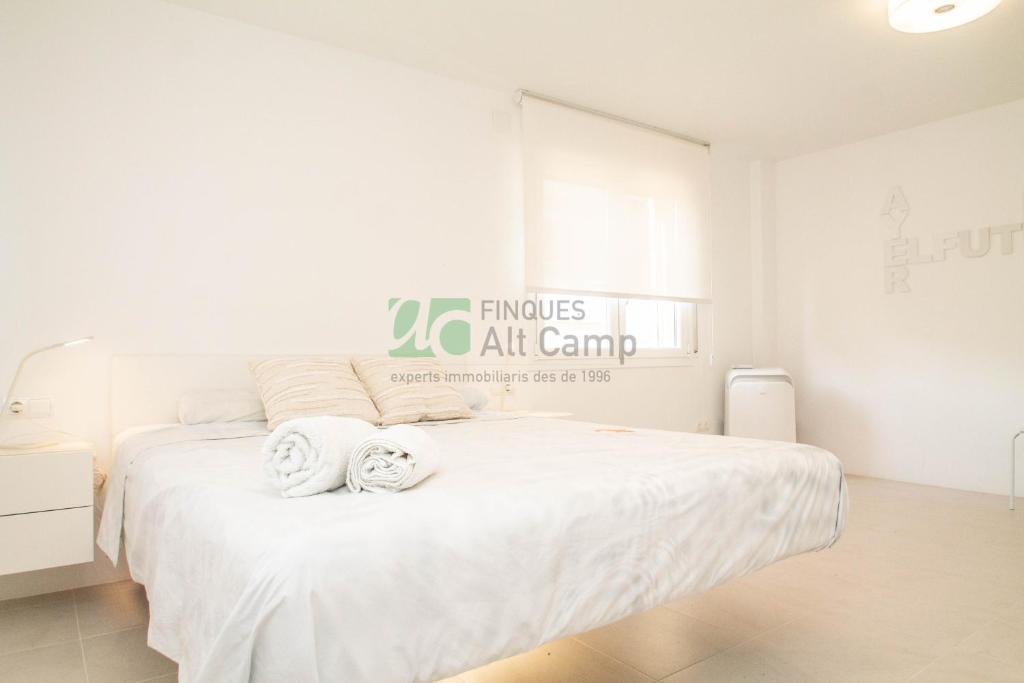 Postel nebo postele na pokoji v ubytování piso alto standing en Segur de Calafell