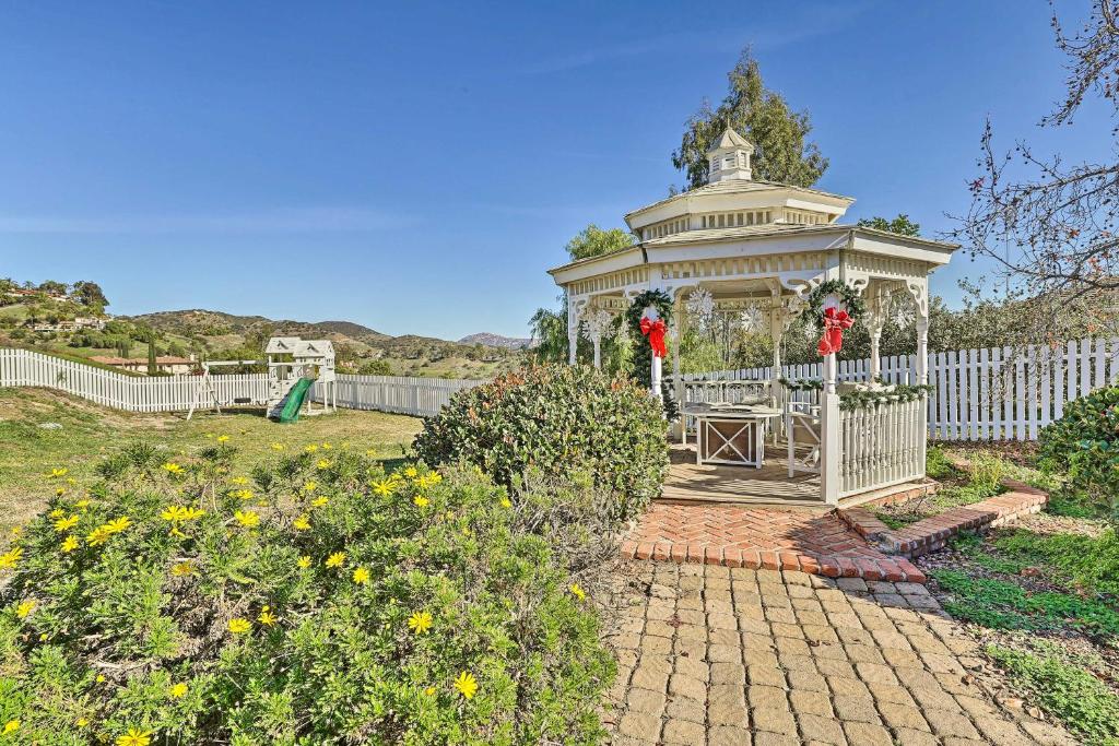 a gazebo in the middle of a garden at Fallbrook Home with Garden, Gazebo and Fire Pit! in Fallbrook