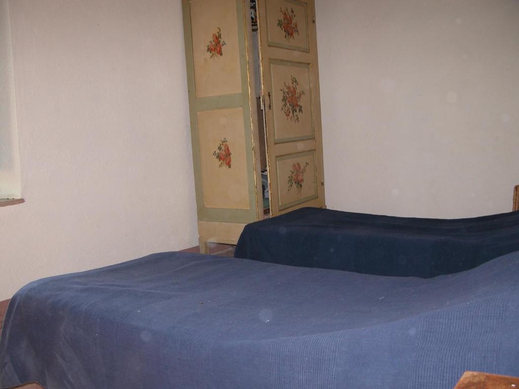 Postel nebo postele na pokoji v ubytování Castello di Mongiovino
