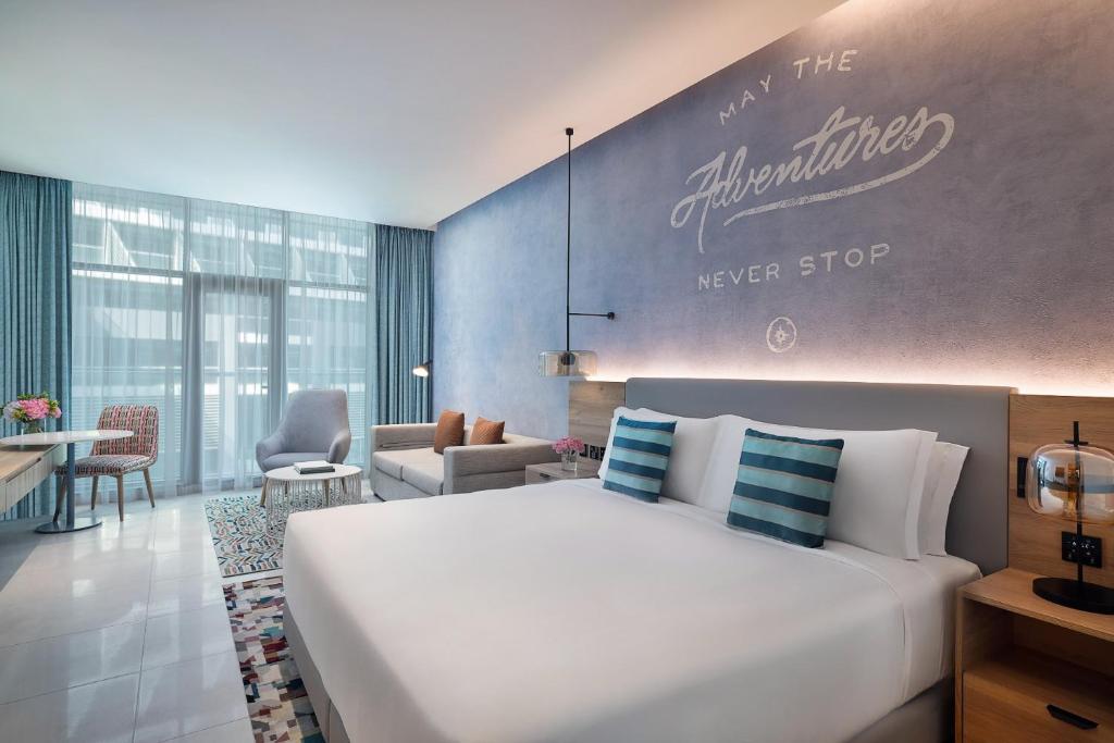 
Deluxe Family Room with Balcony, Beach & Rooftop Infinity Pool Access, Kids Club Access ,Shuttle to Mall Of Emirates
