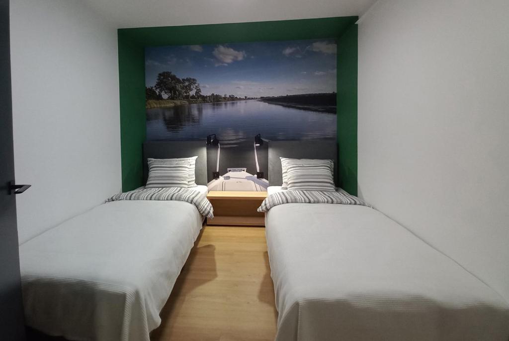 Postel nebo postele na pokoji v ubytování Apartamenty Między Mostami