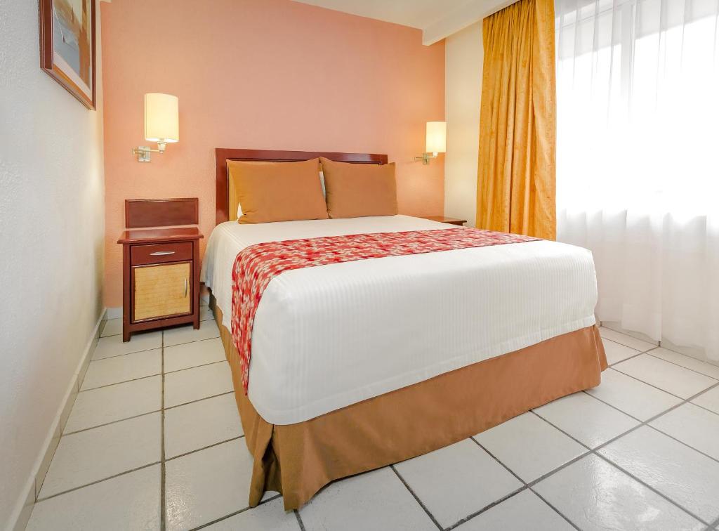 Postel nebo postele na pokoji v ubytování Hotel Veracruz Centro Histórico