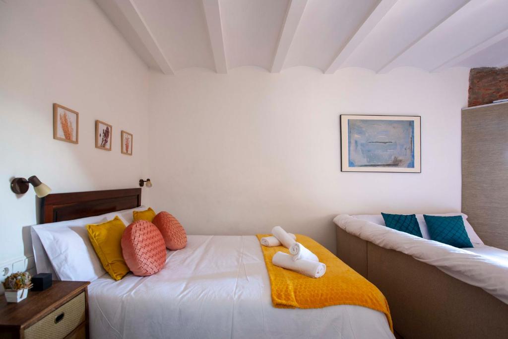 Posteľ alebo postele v izbe v ubytovaní Apartamentos Turísticos Lobelia Suites
