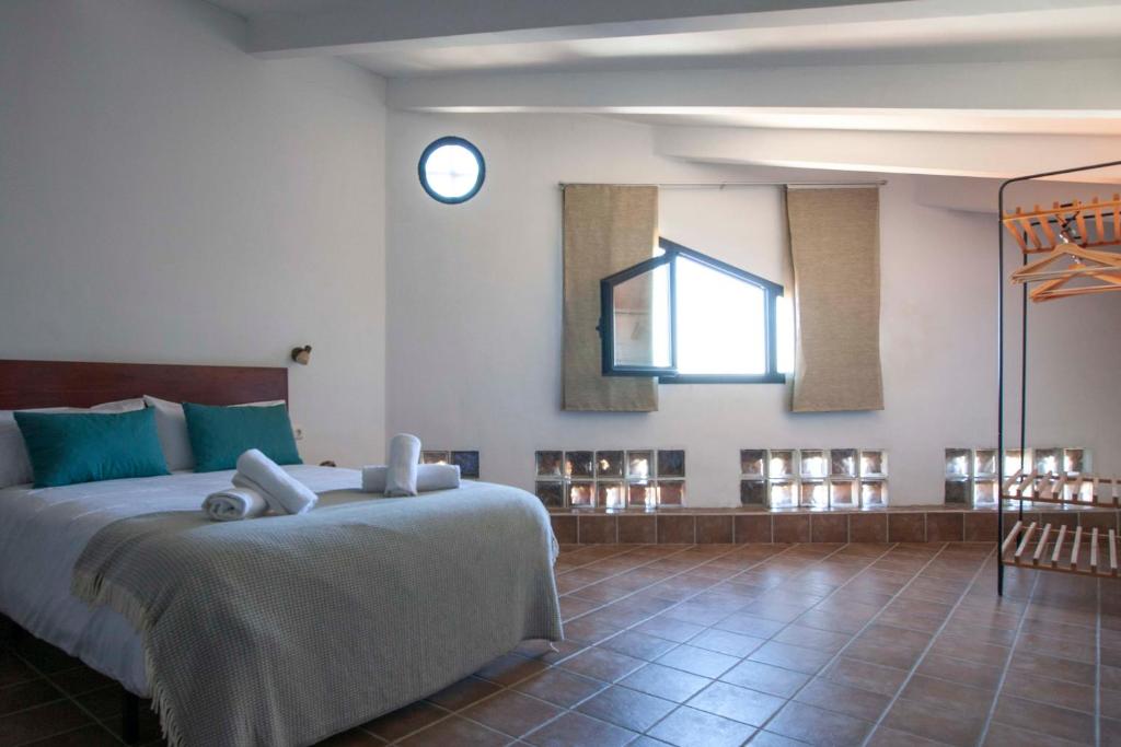 Posteľ alebo postele v izbe v ubytovaní Apartamentos Turísticos Lobelia Suites
