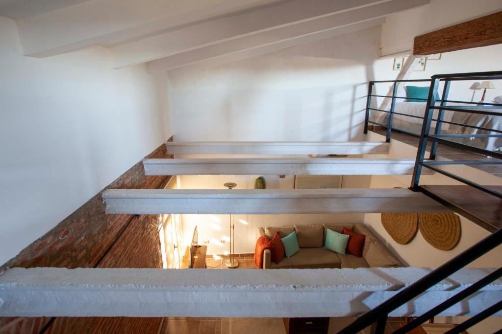 Posteľ alebo postele v izbe v ubytovaní Apartamentos Turísticos Lobelia Suites