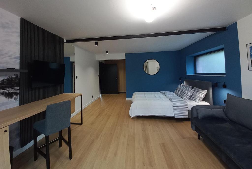 Postel nebo postele na pokoji v ubytování Apartamenty Między Mostami