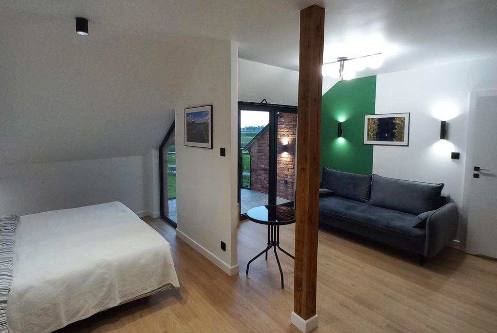 Postel nebo postele na pokoji v ubytování Apartamenty Między Mostami