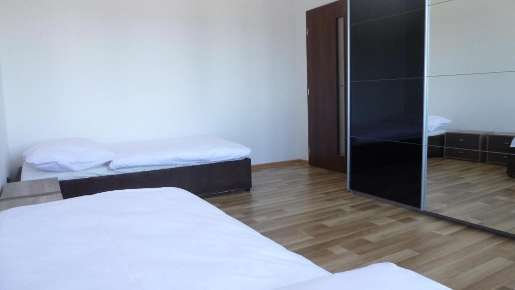 Postel nebo postele na pokoji v ubytování Apartmanovy byt pri Zubačke