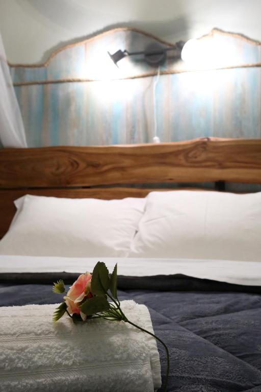 Postel nebo postele na pokoji v ubytování Kadmilos suites Samothraki
