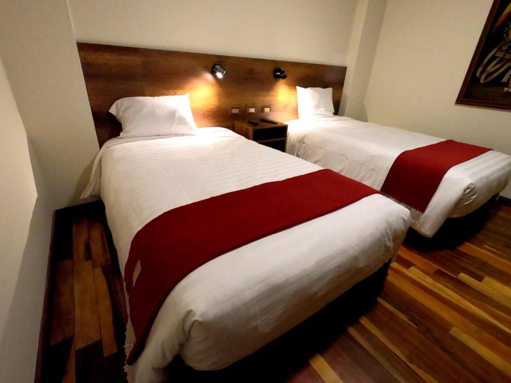 Postel nebo postele na pokoji v ubytování Zans Apartments Cusco