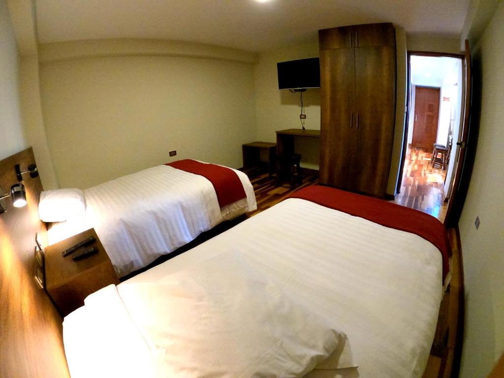 Postel nebo postele na pokoji v ubytování Zans Apartments Cusco