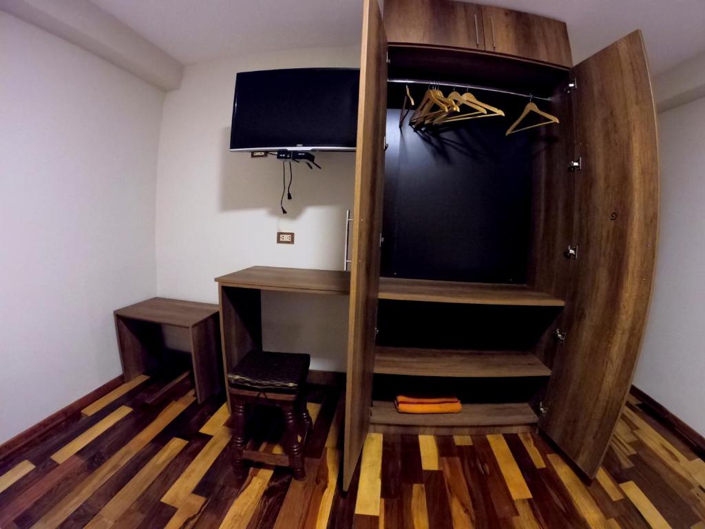 TV a/nebo společenská místnost v ubytování Zans Apartments Cusco