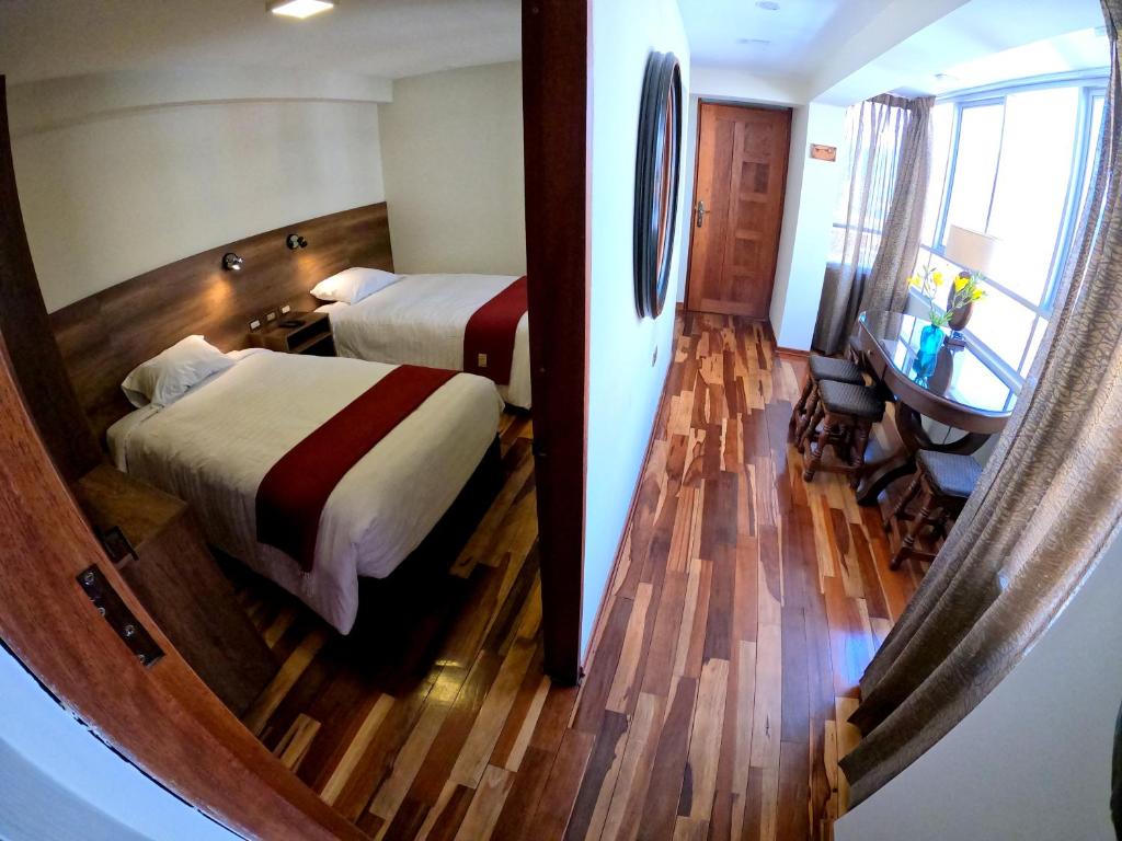 Postel nebo postele na pokoji v ubytování Zans Apartments Cusco