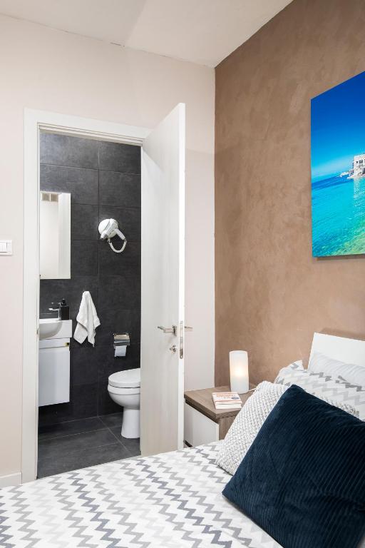 Postel nebo postele na pokoji v ubytování Luxury Msida Circle Suites