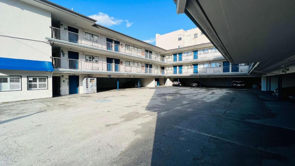 an empty parking lot in front of a building at Motel 6 San Francisco CA Fisherman"s Wharf in San Francisco