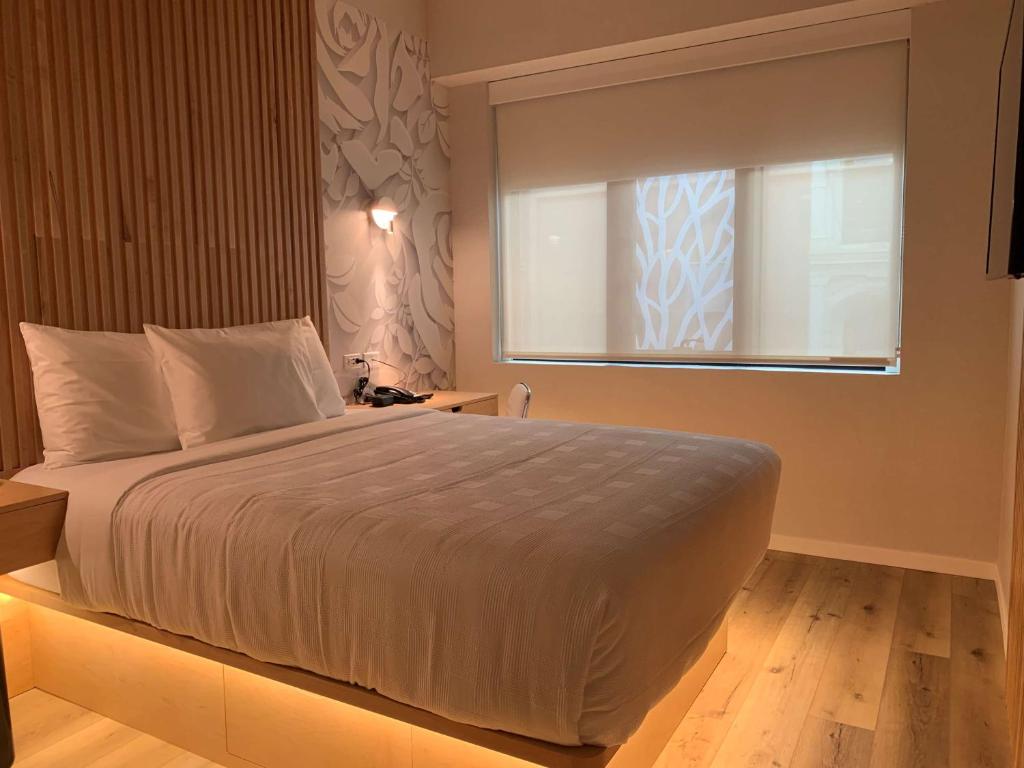 Postel nebo postele na pokoji v ubytování Best Western Plus Soho Hotel