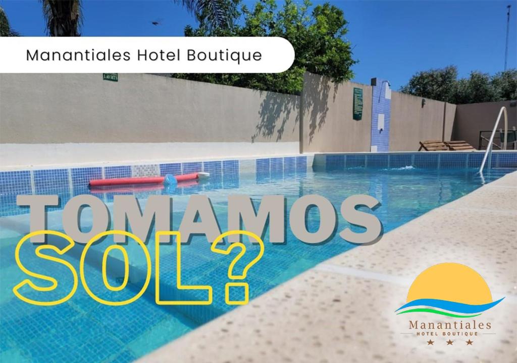 znak, który czyta tomamos solosaosa basen w obiekcie Manantiales Hotel Boutique w mieście Victoria