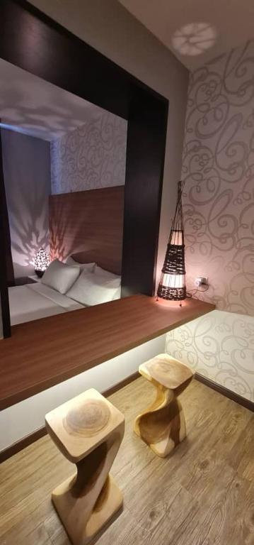 Postel nebo postele na pokoji v ubytování D Elegance Hotel