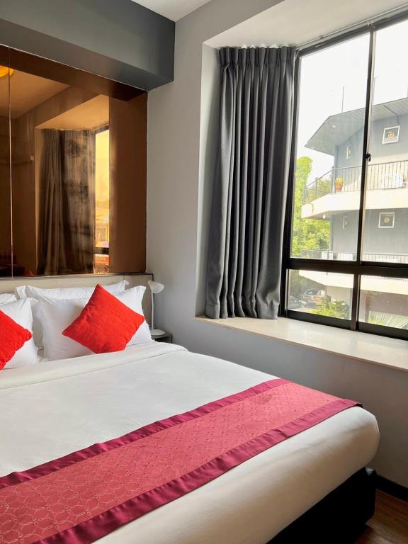 Postel nebo postele na pokoji v ubytování Bayu 23 Hotel