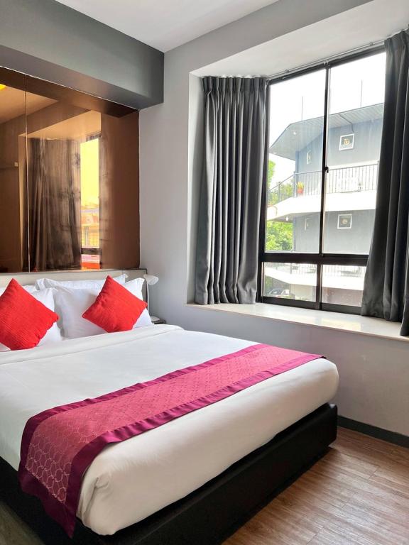 Postel nebo postele na pokoji v ubytování Bayu 23 Hotel