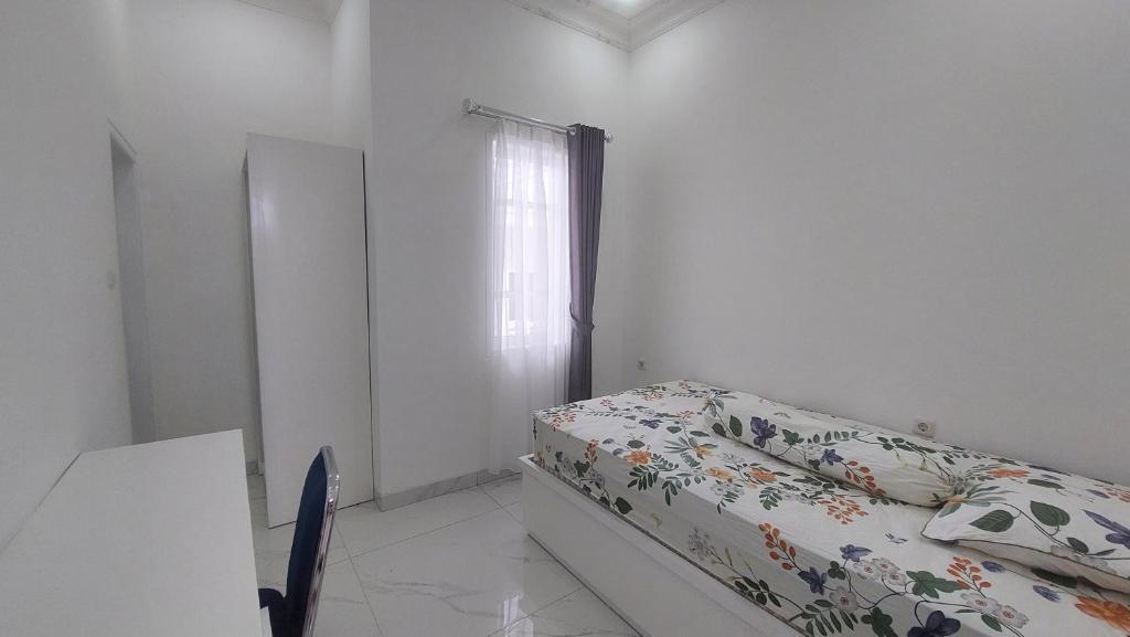 Postel nebo postele na pokoji v ubytování Hotel Wisma Mangurna