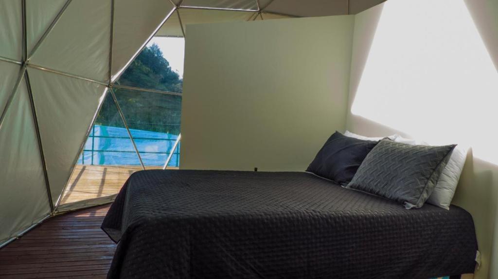 Postel nebo postele na pokoji v ubytování La Quinta Dimensión Glamping