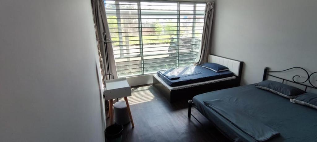 Postel nebo postele na pokoji v ubytování TAR HOMESTAY