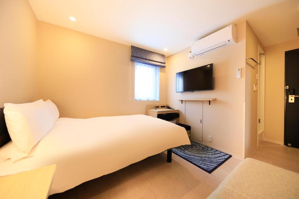 TV a/nebo společenská místnost v ubytování Hotel Nihonbashi Saibo