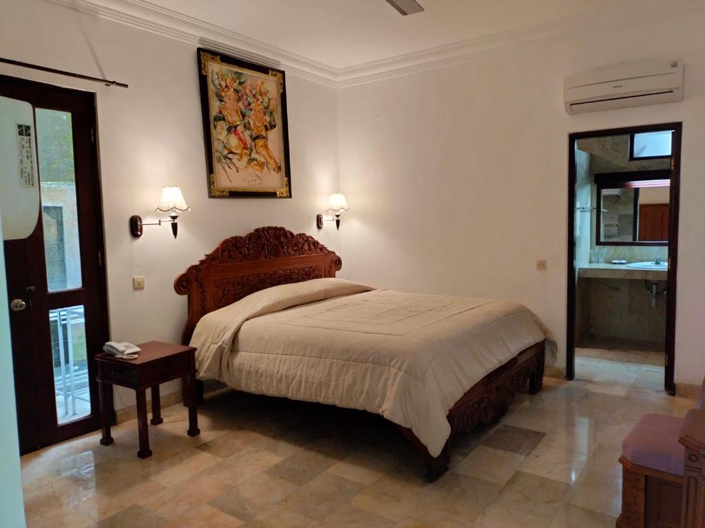 Postel nebo postele na pokoji v ubytování Grand Kumala Hotel - Hotel Kumala Legian Kuta Bali