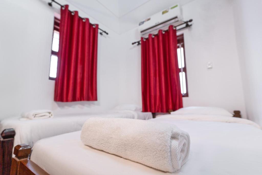 Postel nebo postele na pokoji v ubytování Anamala Serenity Homestay Kerala