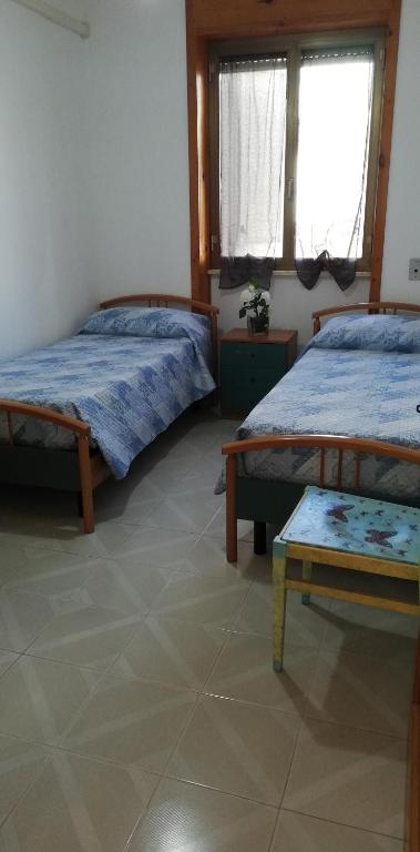 Letto o letti in una camera di Amata Villa Vacanza