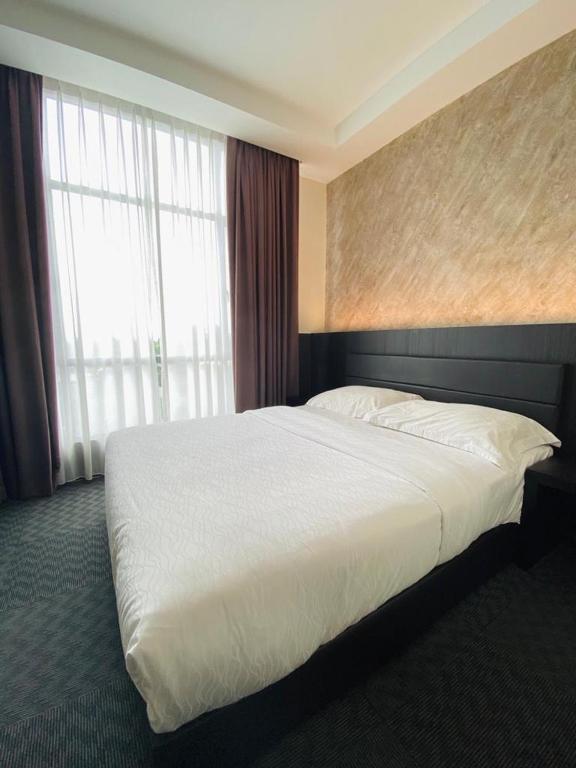 Postel nebo postele na pokoji v ubytování Just Hotel BP
