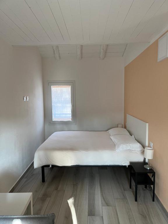 Posteľ alebo postele v izbe v ubytovaní Terrazza Montegrappa