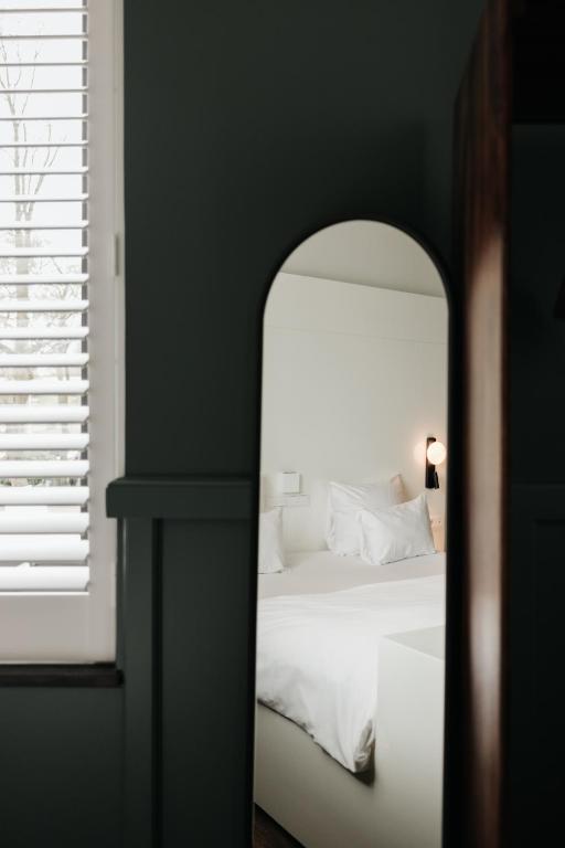 Postel nebo postele na pokoji v ubytování Hotel & Spa Savarin - Rijswijk, The Hague