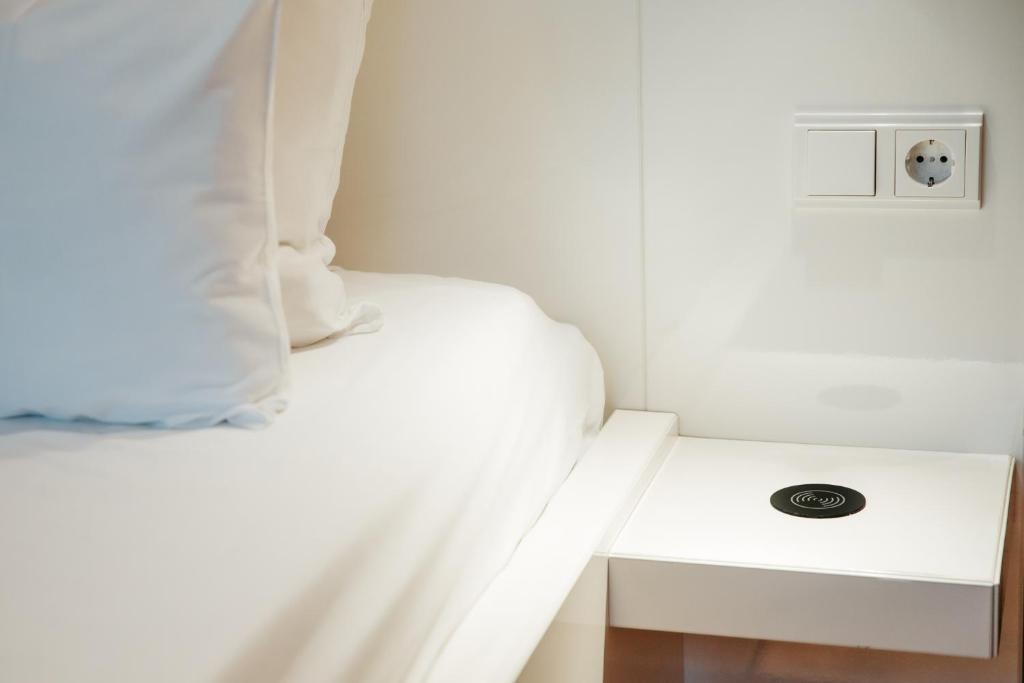 Postel nebo postele na pokoji v ubytování Hotel & Spa Savarin - Rijswijk, The Hague