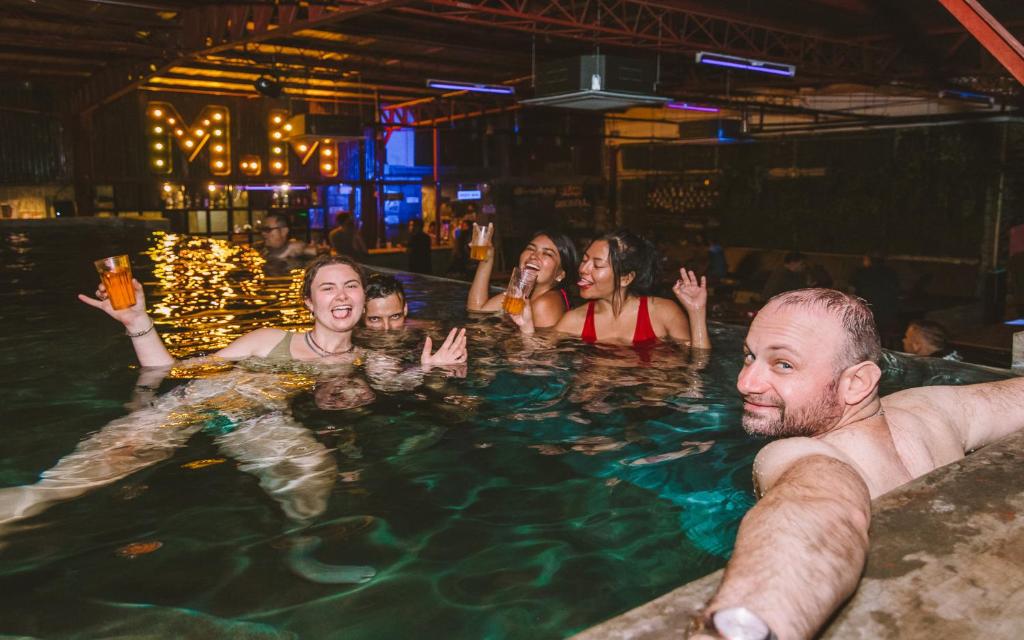 a group of people in a swimming pool at Mad Monkey Cebu City in Cebu City