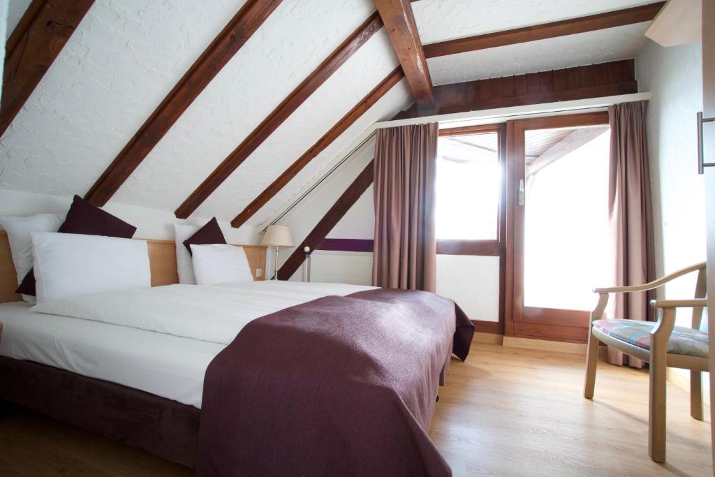 Postel nebo postele na pokoji v ubytování Olympia Hotel Zurich