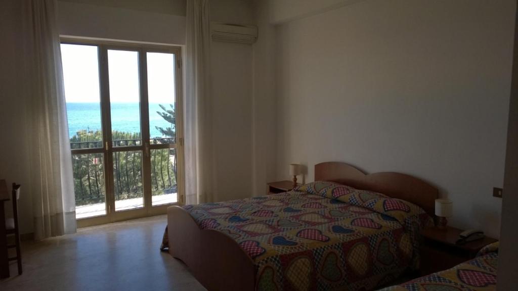 Postel nebo postele na pokoji v ubytování Hotel Panama