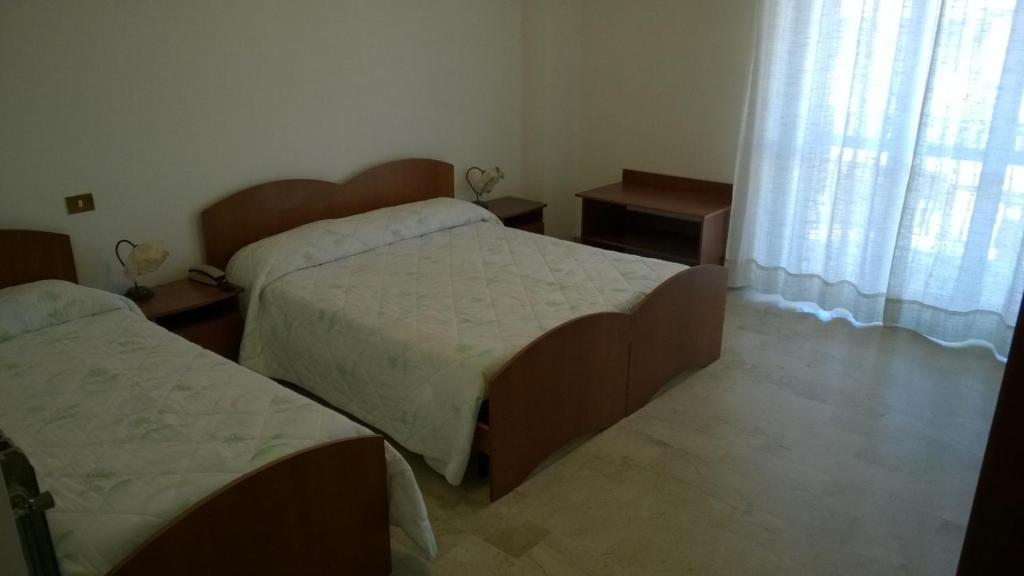 Postel nebo postele na pokoji v ubytování Hotel Panama