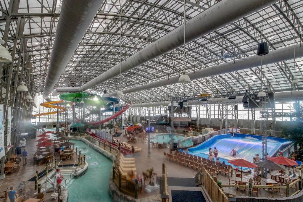 a large indoor water park with a large swimming pool at Jay Peak Village Home 367B in Jay