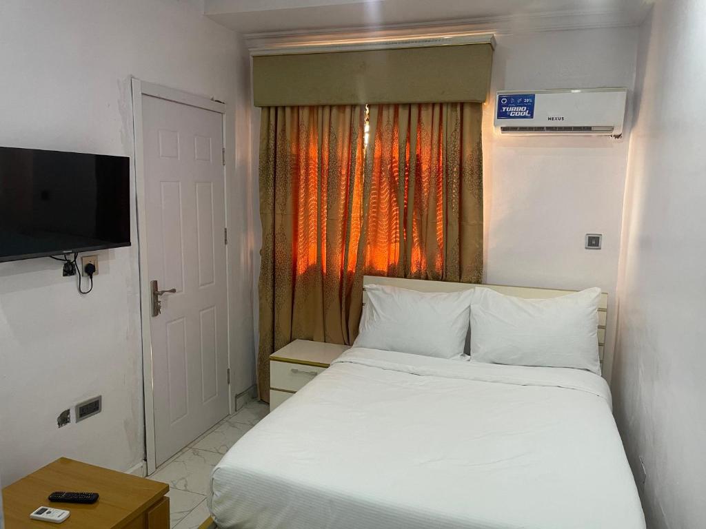 Postel nebo postele na pokoji v ubytování White Gold Hotel