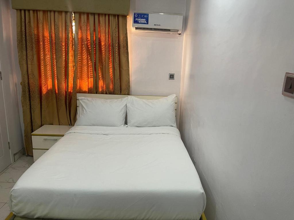 Postel nebo postele na pokoji v ubytování White Gold Hotel