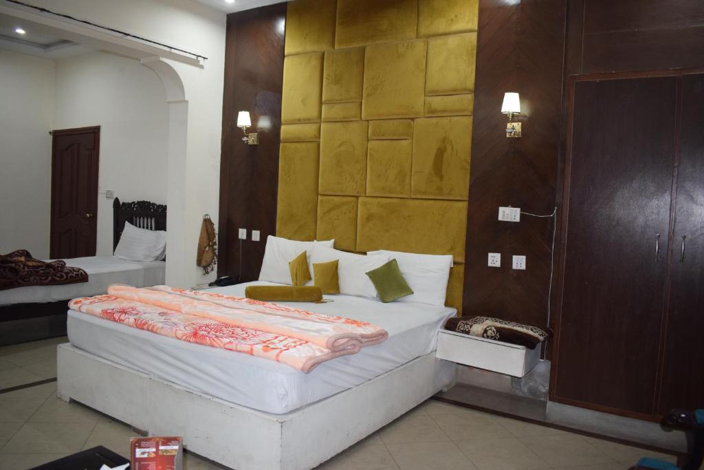 Postelja oz. postelje v sobi nastanitve Hotel Royal Luxury Multan