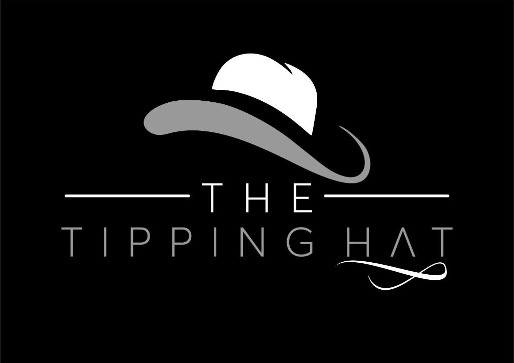 a logo for the flipping hat on a black background at The Tipping Hat, Eldoville in Eldoret