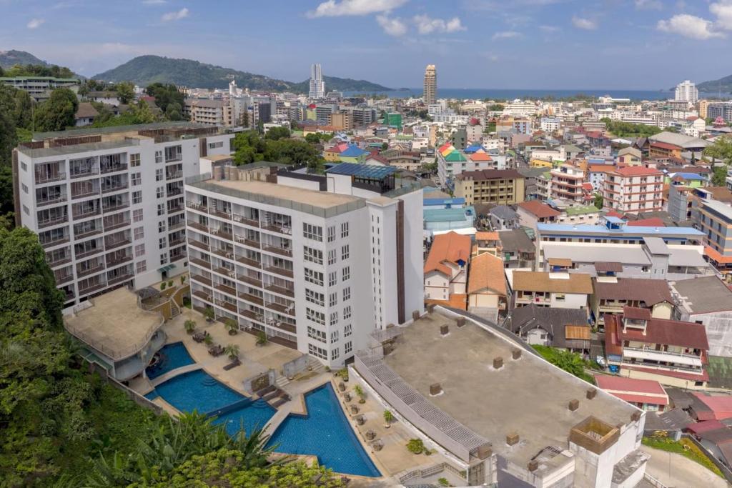 an aerial view of a city with buildings at Oceanview Treasure Hotel and Residence in Patong Beach