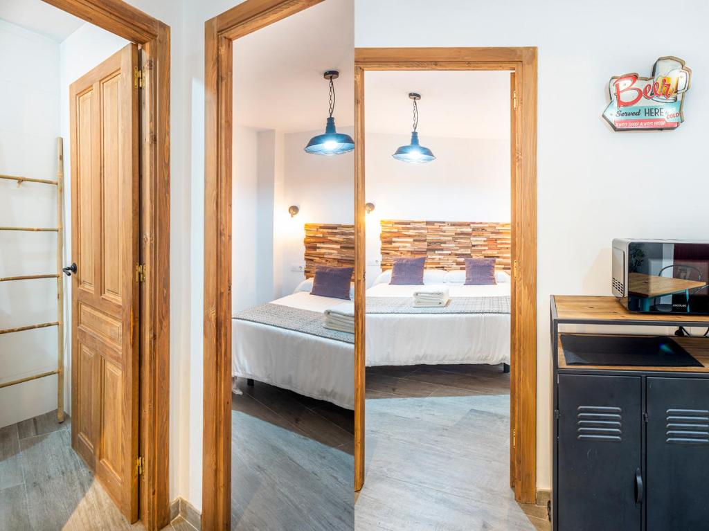 A bed or beds in a room at Alohamundi Molino